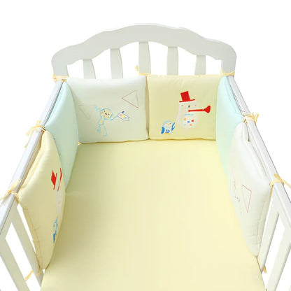 Six 30x30cm cotton baby bed protection panels with hard cotton filling arranged around crib
