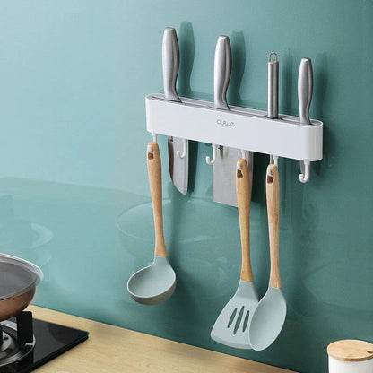 Sleek wall-mounted knife organizer with slots for knives and hooks for storing kitchen essentials