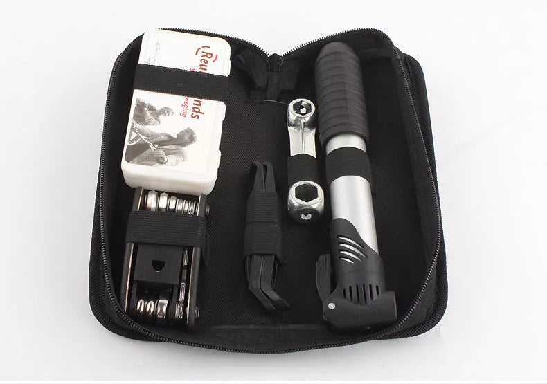 SNJUE Tool Kit with various tools including wrenches, screwdrivers, and tire repair items