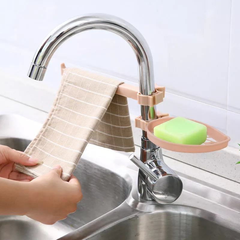 Clip-on adjustable sink drain basket in light green and pink for sponges and rags