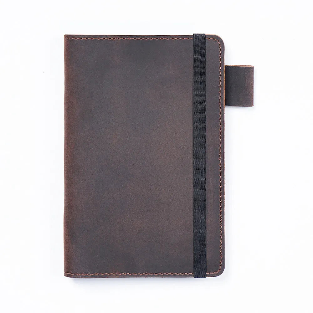 Handmade cowhide kraft notebook open showing wood-free paper, in dark green colour