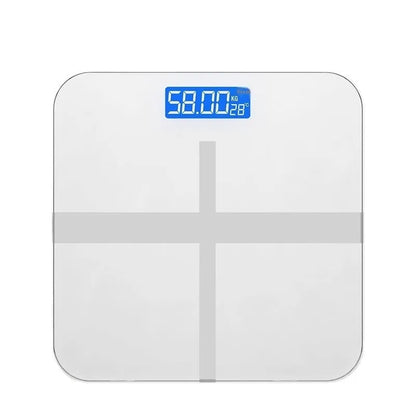 Household digital bathroom scale with large tempered glass top in rose gold finish on white bathroom floor.