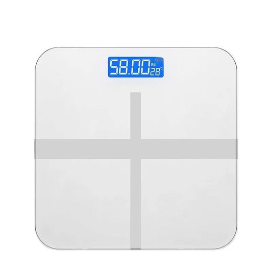 Household digital bathroom scale with large tempered glass top in rose gold finish on white bathroom floor.