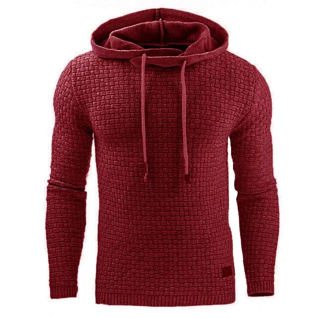 Man wearing a cotton-polyester blend hooded sweatshirt in grey, showing the front design and hood.