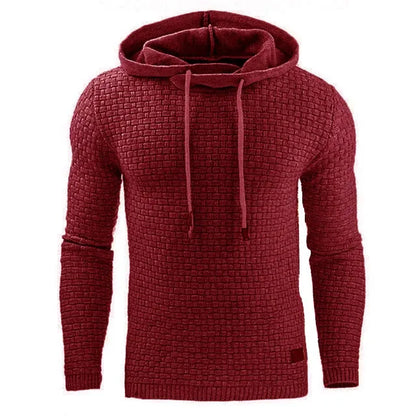 Man wearing a cotton-polyester blend hooded sweatshirt in grey, showing the front design and hood.