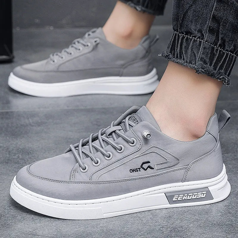Grey men's low-top canvas casual trainers with lace-up front and round toe