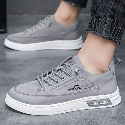 Grey men's low-top canvas casual trainers with lace-up front and round toe