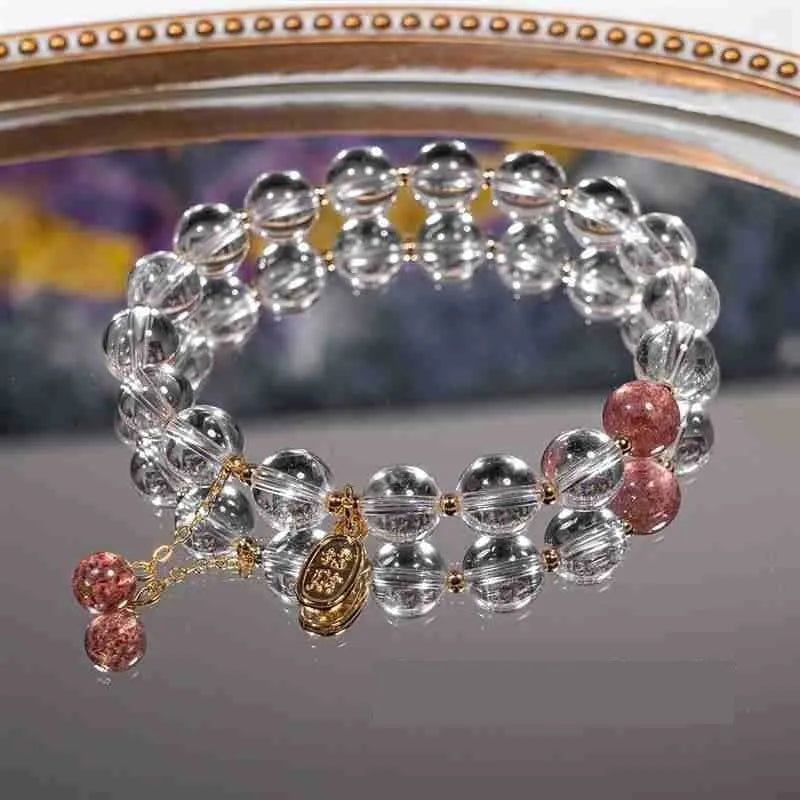 Handmade white crystal bracelet with 8mm beads and U-shaped design on wrist