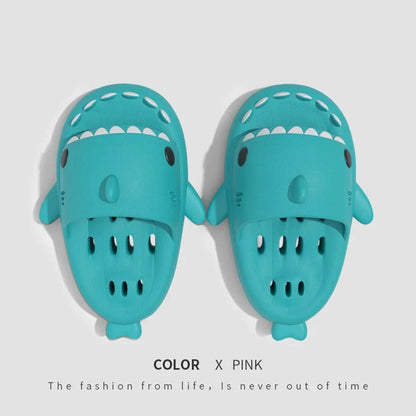 Colorful shark-themed shower slides with drainage holes, designed for comfortable and practical use in the pool or shower.