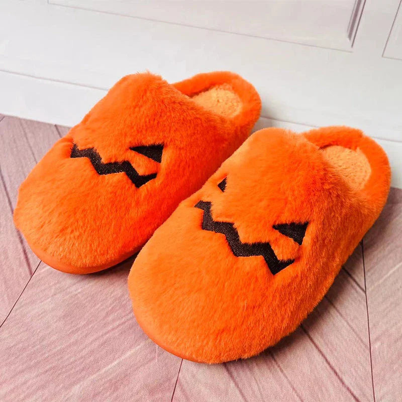 Cozy Halloween pumpkin-themed slippers with plush lining and non-slip soles for comfortable indoor wear