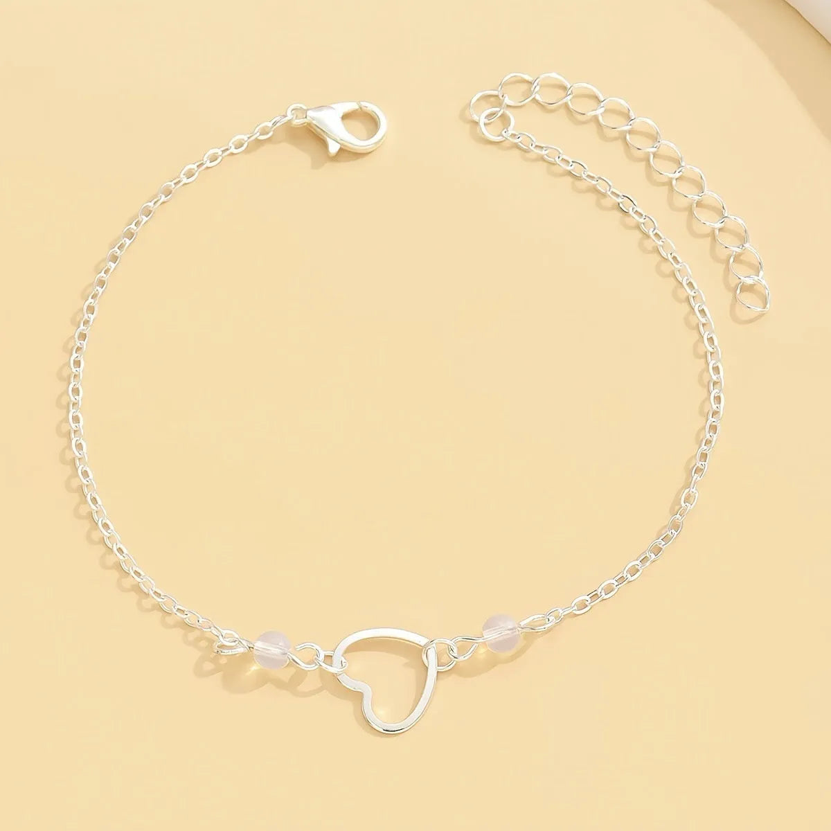 Women's adjustable heart anklet jewellery in gold or silver alloy with geometric design