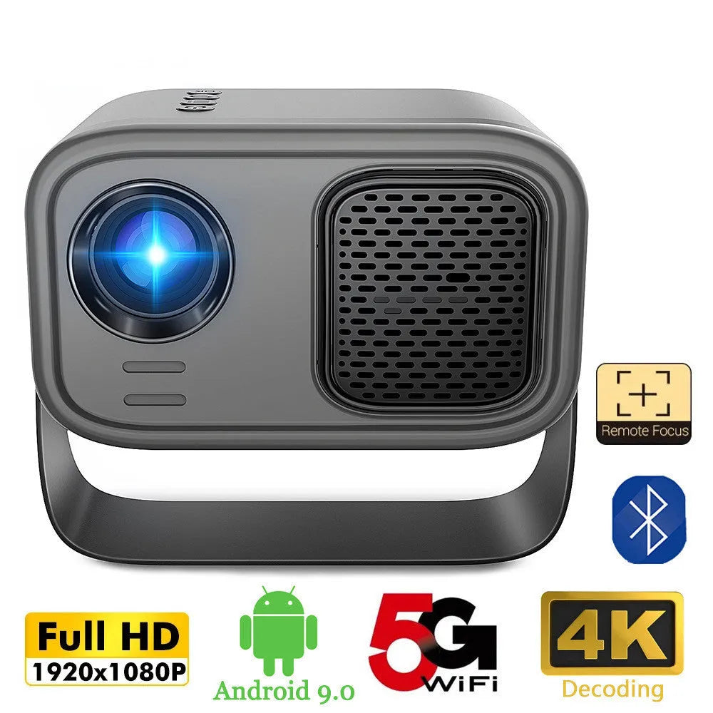 Black HD smart portable projector with remote control and cables on a table