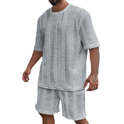 Knitted short-sleeve pullover and matching shorts set in light grey, laid flat.