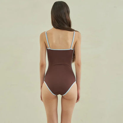 Brown women's one-piece swimsuit with V-neck front and adjustable tie straps at neck and back.