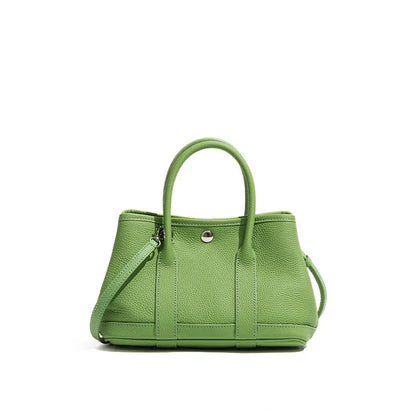 Genuine leather crossbody bag for women in first layer cowhide, horizontal square shape, single shoulder strap, shown in chicken yellow