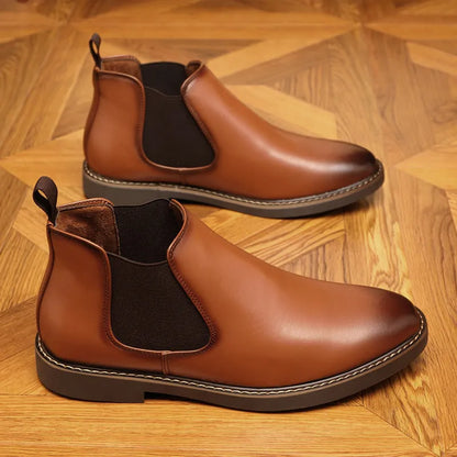 Black and brown formal pointed-toe leather boots with a square heel on a rubber sole.