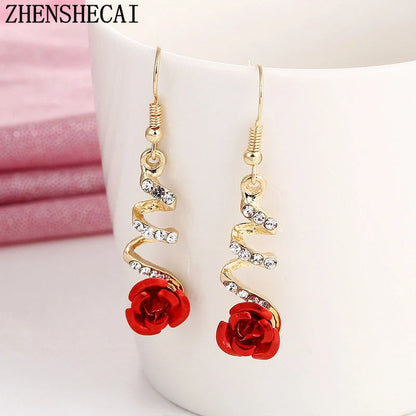 Ethnic red rose drop earrings with big rhinestones in rose gold spiral design