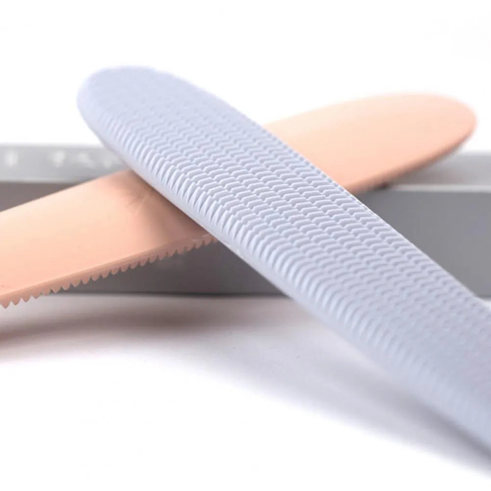 Grey and pink cat grooming comb with tongue massage design and dual-ended narrow and wide sections