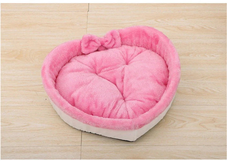 Cozy heart-shaped pet bed in grey and pink colors, suitable for cats and small dogs