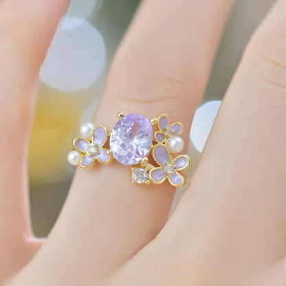 Adjustable open ring with flower design featuring pearl and zircon elements in yellow or light purple finish