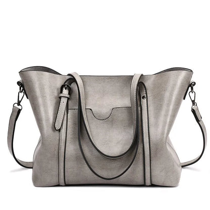 Retro messenger bag showing 31cm length, A4 magazine capacity, available in eight colours including wine red and light blue