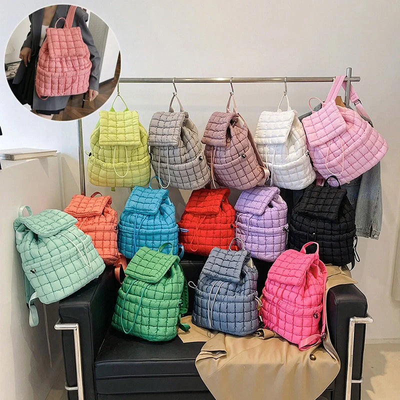 Soft, quilted puffer backpack in a variety of colors, perfect for autumn and winter wear