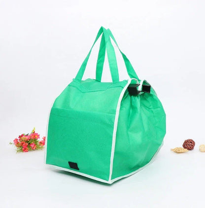 Foldable reusable grocery tote bag in green color, featuring durable construction, generous pockets, and a fold-flat design for easy storage