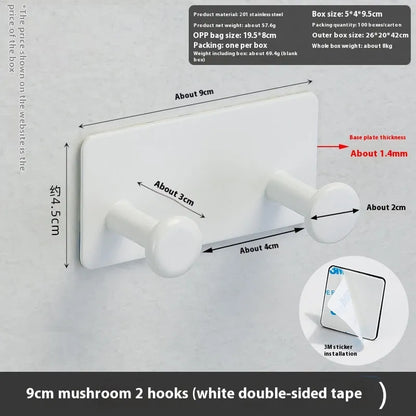 Screwless mushroom-style clothes hook with adhesive backing, shown in white on a tiled wall.