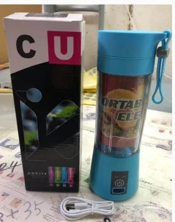 Pink portable USB electric fruit juicer blender cup with stainless steel blade and carry handle.