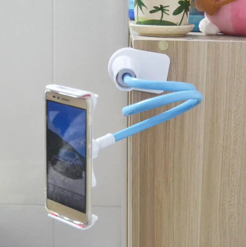 Bedside oversize flat panel handset with long arm holding a mobile phone on a table