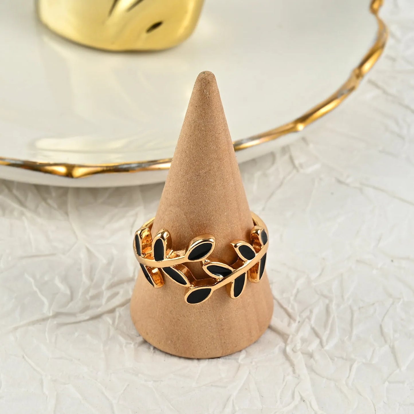 Gold electroplated geometric ring with leaf motif and acrylic accents for women's index finger
