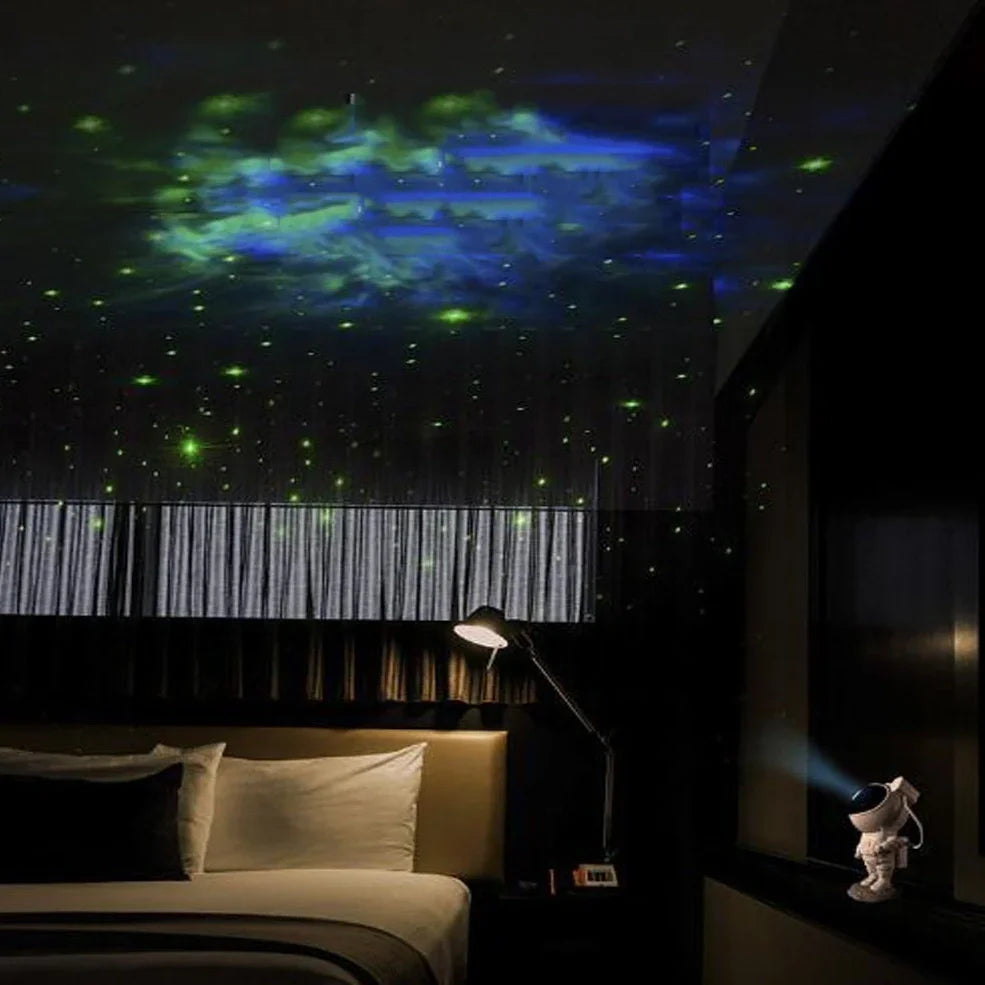 Astronaut-themed galaxy projector with adjustable nebula effects on table showing starry sky projection