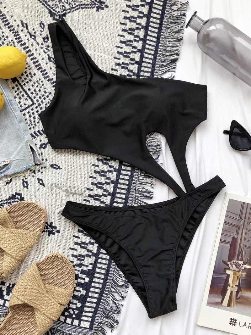 One-piece bikini swimwear for women with chest pad in black and pink