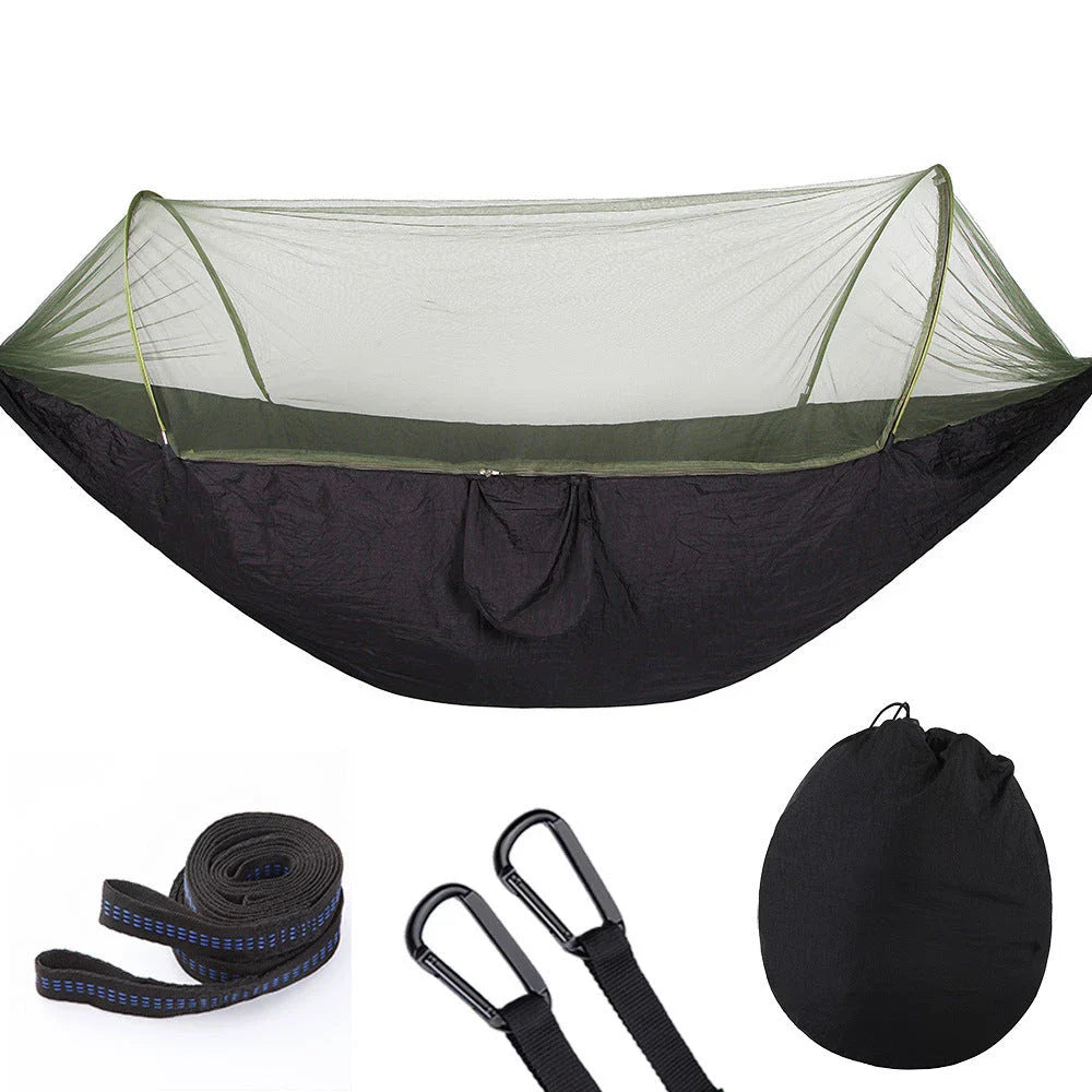 Cozy outdoor hammock with mosquito net for relaxing in nature and outdoor adventures