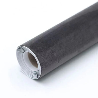 Rolls of self-adhesive leather suede in multiple colours showing texture and adhesive backing.