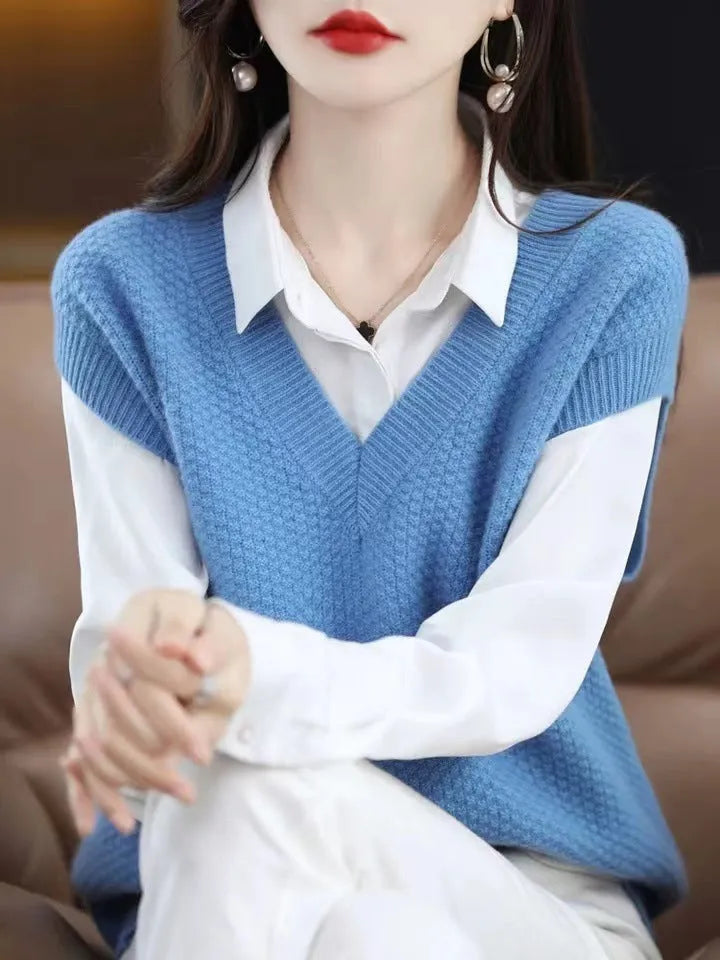 Women's creamy-white sleeveless knit vest with a raised 3D pattern, shown on a hanger.