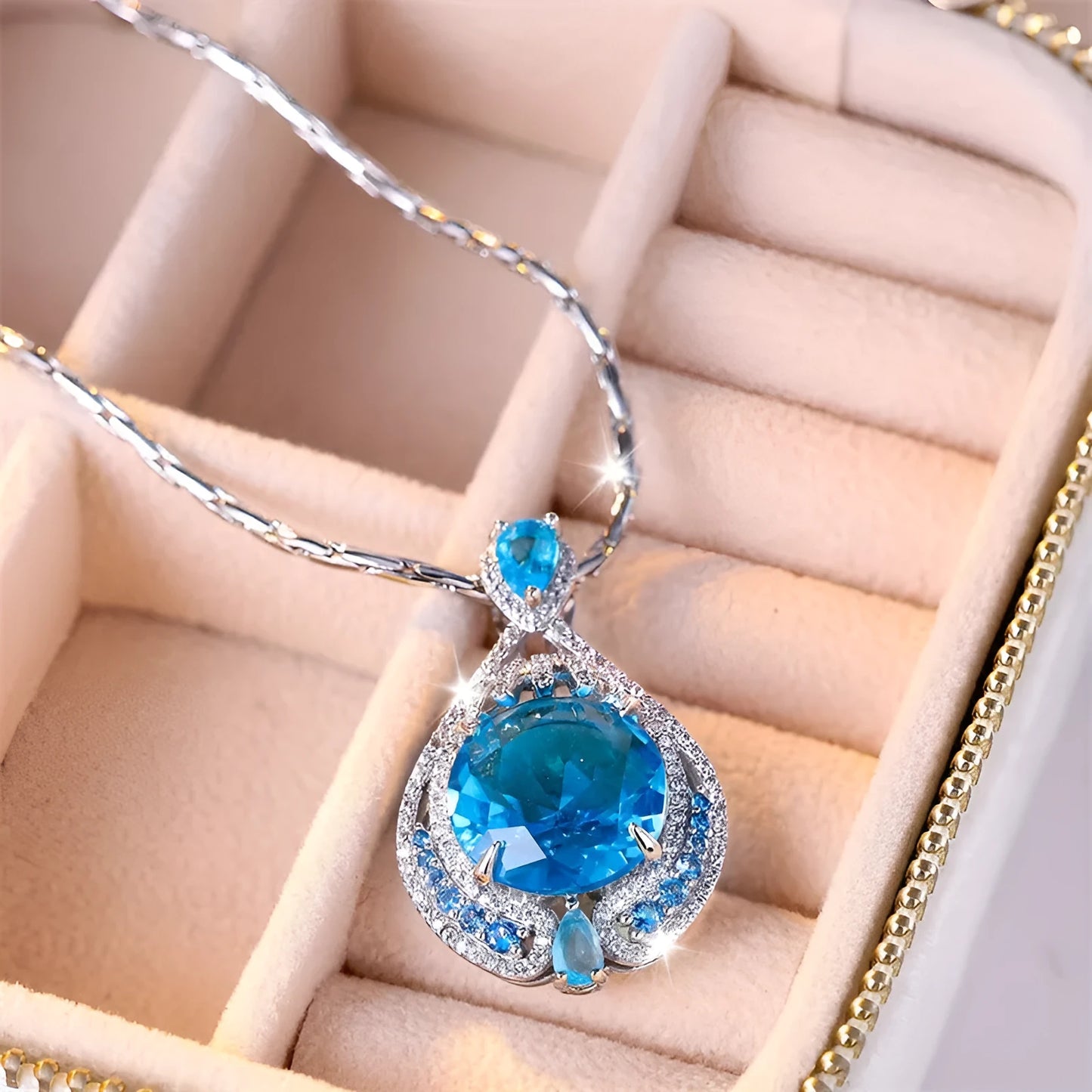 Women's blue crystal necklace with geometric fireworks-cut pendant on water wave alloy chain