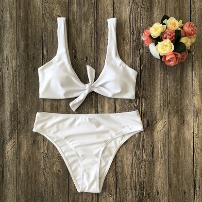 Women's two-piece bikini set in a solid colour on a white background, showing sleeveless bra and briefs.