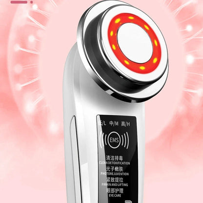 Pink and white facial massager for deep pore cleansing and skin rejuvenation with light therapy