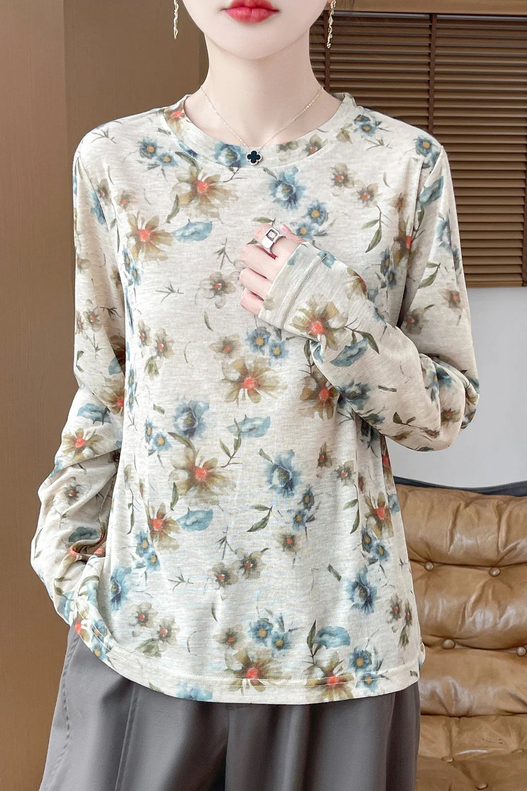 Round neck floral print pullover shirt in Tencel cotton blend fabric on hanger
