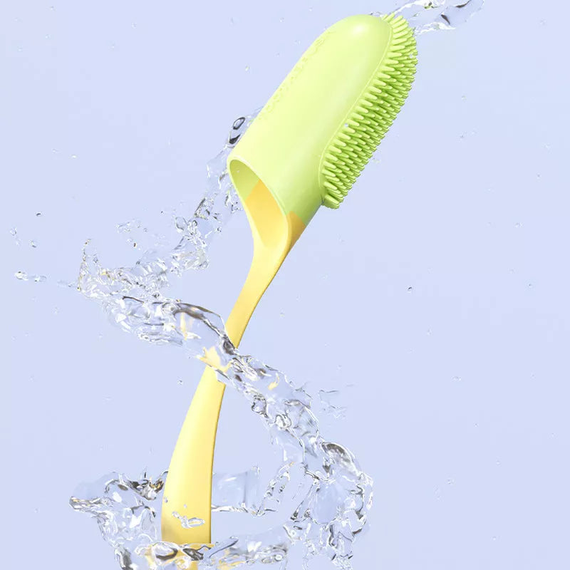 Silicone finger toothbrush for dogs and cats in pink, yellow, and white