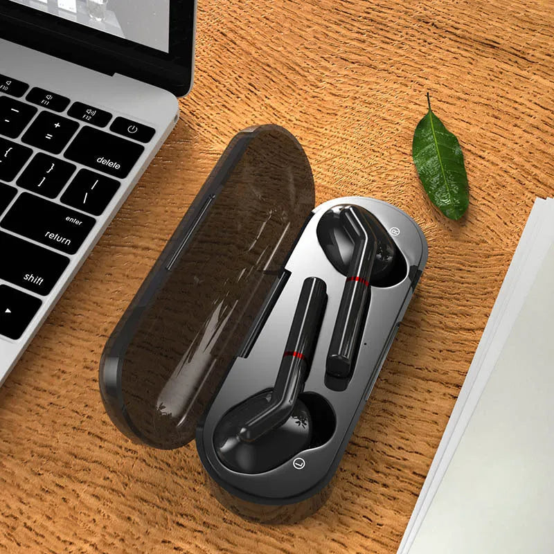 VV1 black and white Bluetooth earphones with a compact charging case on a table.