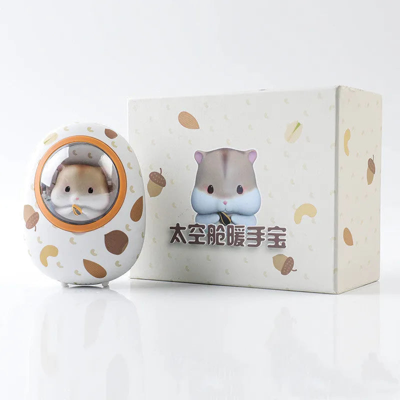 White Hamster hand warmer and power bank unit with 5000mAh capacity on a plain background.