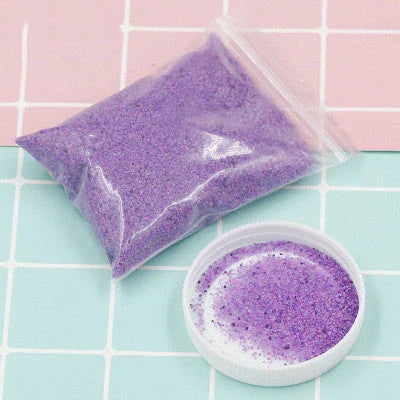 Magical self-adhesive space sand in various colors, allowing for endless creative sculpting and molding even when submerged in water