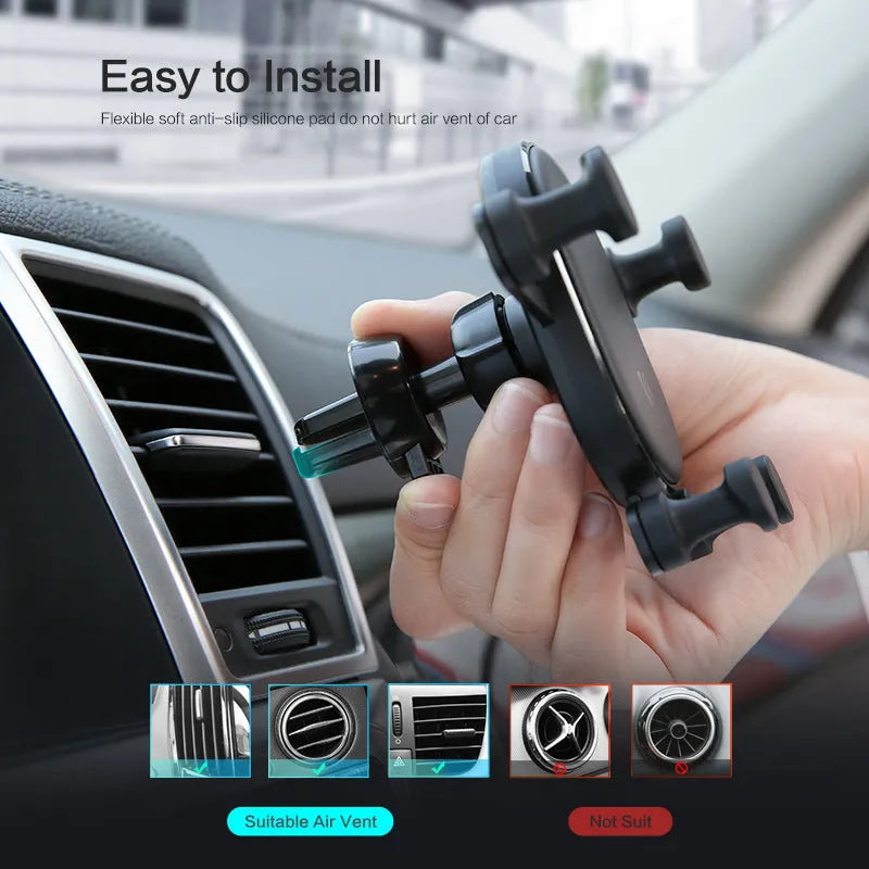 Black car vent phone holder with gravity lock mechanism, shown holding a smartphone at an angle.