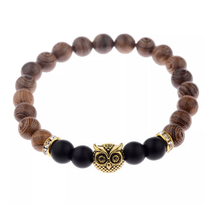 Owl frosted stone lifeline wood grain bracelet in black and gold, featuring wood beads and alloy stone