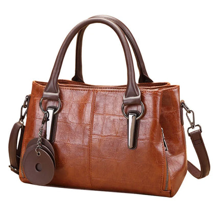 Retro contrast large capacity shoulder bag showing horizontal square shape and multiple internal compartments