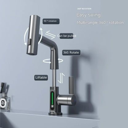 Modern digital display kitchen tap with pull-out spray hose showing LED temperature screen.