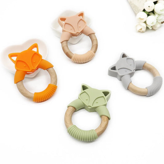 Wooden fox teether with orange silicone ring measuring 80mm high