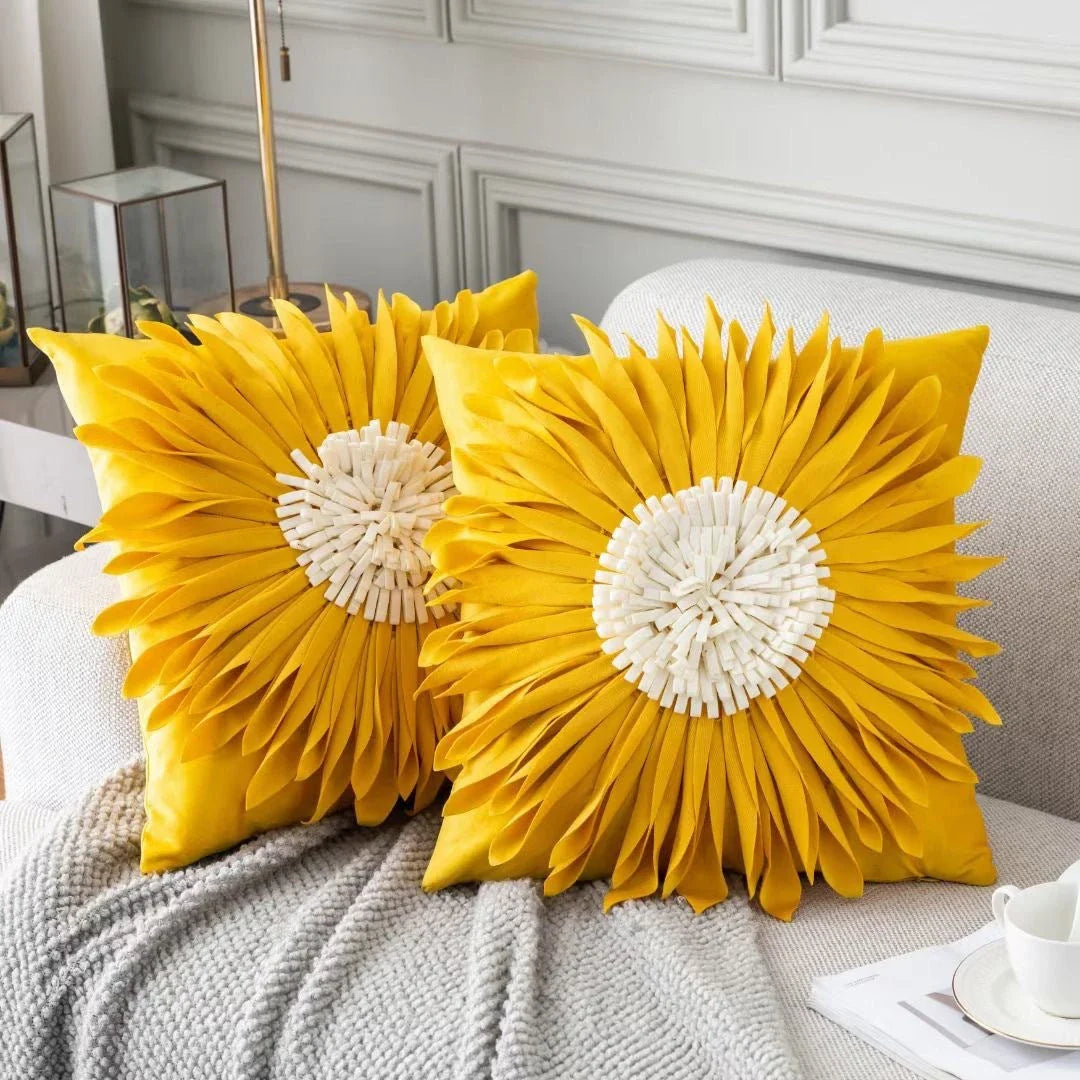 Stylish velvet throw pillows with 3D chrysanthemum embellishments in blue, yellow, pink, and white colors